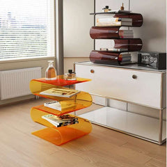 Modern acrylic side table with tiered magazine storage