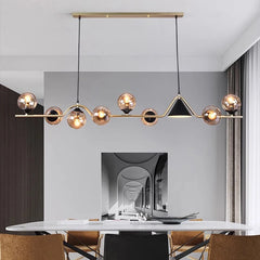 Adjustable globe linear pendant installed above a stylish workspace