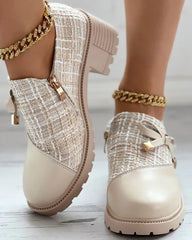 Air mesh gold accent ankle casual women’s boots styled with cropped denim