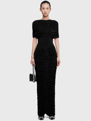 Full-length view highlighting the allover ruching texture and slim fit through the hips, finishing at an ankle-length hem.