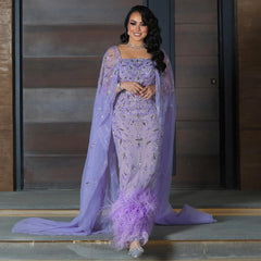A full-length shot of the formal dress, highlighting its unique ankle-length cut.