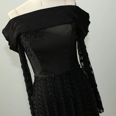 Black ankle-length elegant black cocktail gown designed for modern formalwear details on a mannequin against a grey background