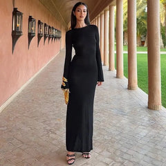 Ankle length knit black dress with gold accents for winter partywear