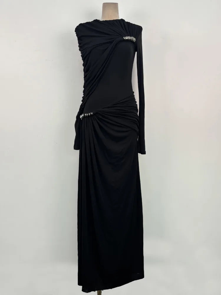 Full-length view showing the ankle-grazing hem and sleek fit, styled minimally for a modern formal look with clean lines.