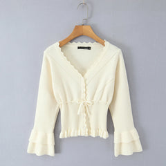 Apricot lace-up cropped knit cardigan styled for spring layering