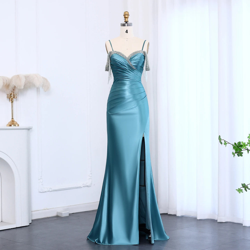 Sweetheart satin mermaid prom gown with tassel accents on mannequin