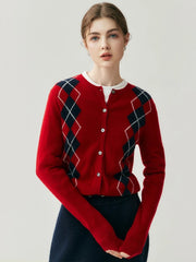 Model wearing an argyle knit cardigan buttoned at the front, styled.