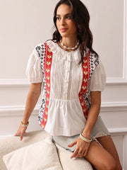 Artisan fashion patchwork blouse with short sleeves indoors