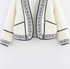 Artisan trimmed knit layer perfect for elevated casual outfits