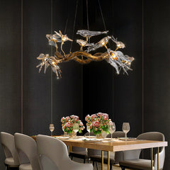 Artistic boho chandelier with birds on a branch for dreamy eating spaces