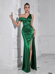 A woman wearing an asymmetric high-split maxi dress in a chic, modern style.