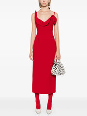 Asymmetric structured red cocktail dress photographed for statement wear