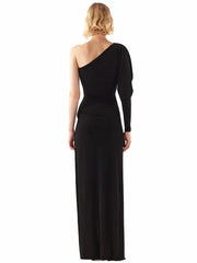 Woman wearing a black one-shoulder evening gown on a white background