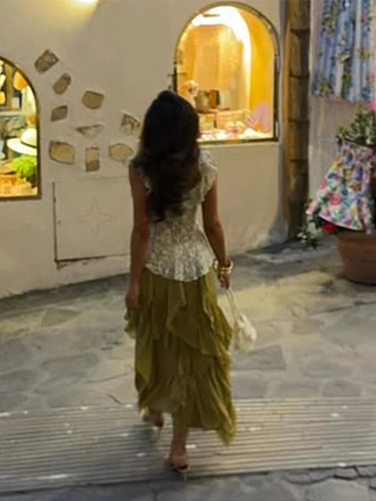 Asymmetrical ruffle skirt and sleeveless crop top outfit