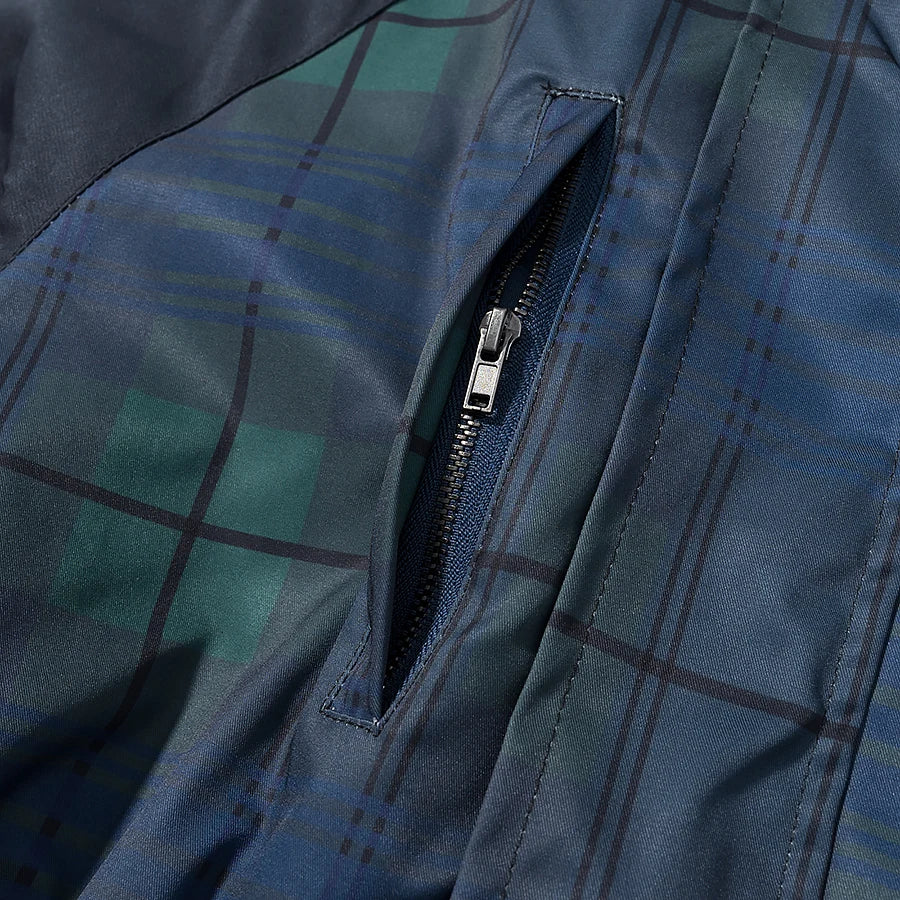 Close-up of a blue plaid jacket with a zipper