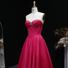 Backless A-line evening dress with flowing satin skirt