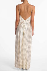 Back view of low-back polka-dot maxi dress with slim straps