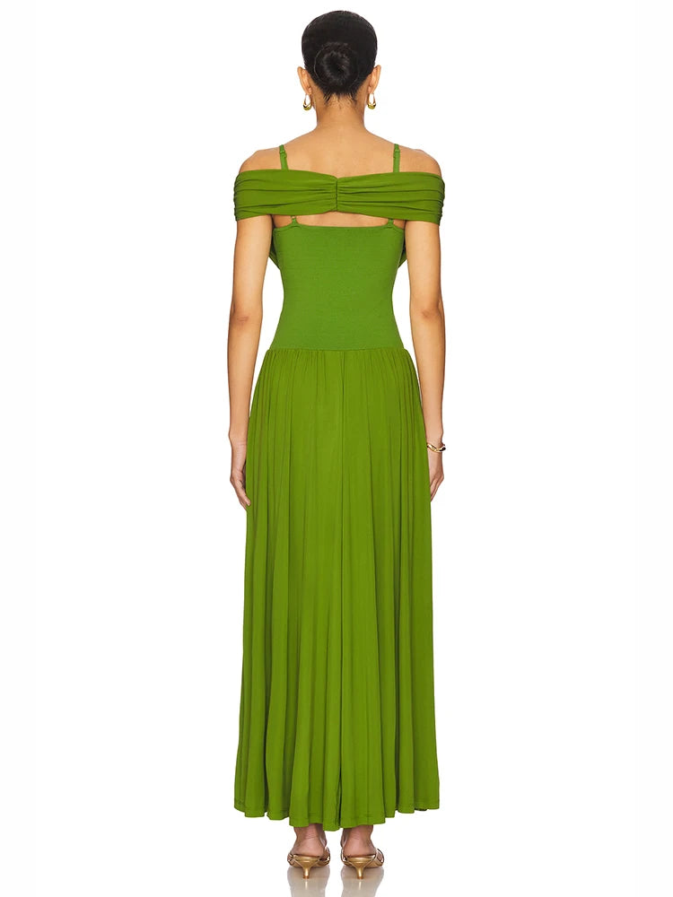 Back of a woman wearing a formal green maxi dress styled for weddings and cocktail events on a white background