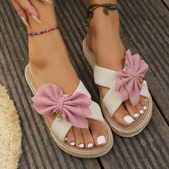 Close-up of non slip TPR sole on pink bowknot women’s slides