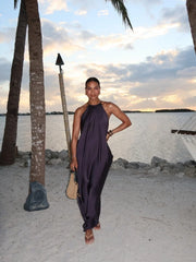 full-length black flowy maxi styled with strappy heels outdoors