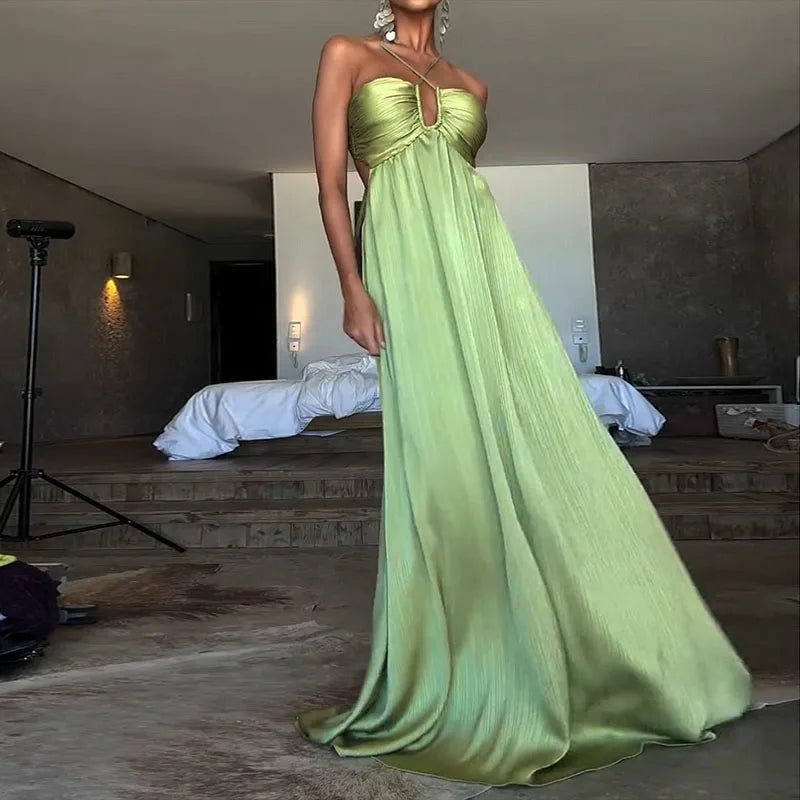 Beach-ready evening dress in green satin with front cutout