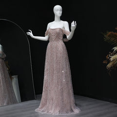 Mannequin wearing a sparkling evening gown against a dark background
