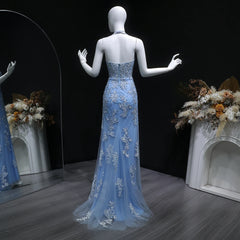 Floor-length tulle evening dress featuring intricate embellishments and open back