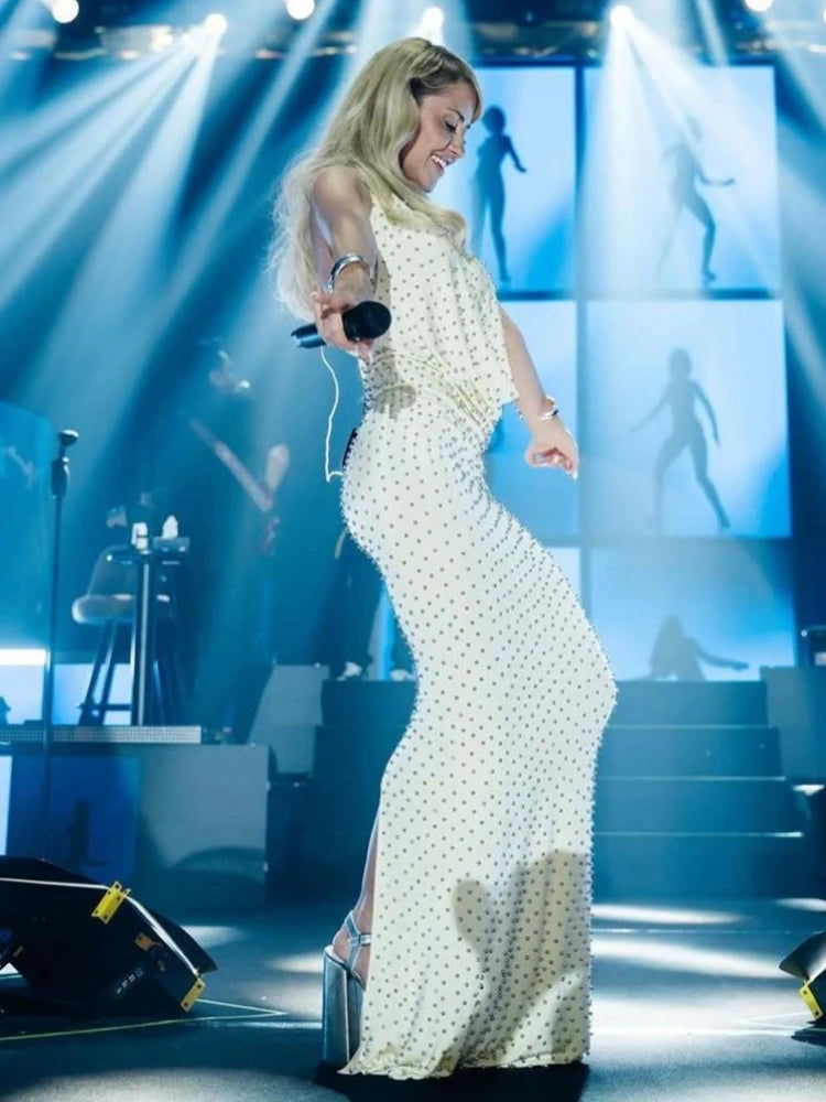 Detail view highlighting the small beaded embellishments across the fabric surface, capturing the light-catching texture without heavy sparkle.