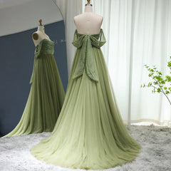 A full-length shot of the beaded formal dress, highlighting the pleated details.