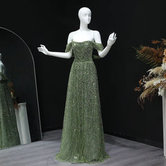 A mannequin wearing an elegant off-shoulder beaded tulle gown for a formal event.