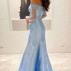A close-up shot of the intricate beading and sequins on the satin bodice and sleeves.