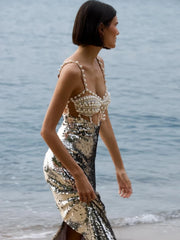 Side view of the silver midi dress capturing the slim sheath silhouette and smooth drape.