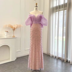 A full-length shot of the beaded tulle evening dress, highlighting its sophisticated silhouette.