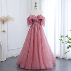 A full-length shot of the beaded tulle formal dress, highlighting its voluminous skirt.