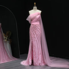 A close-up shot of the intricate beading, sequins, and crystals on the tulle fabric of the dress.