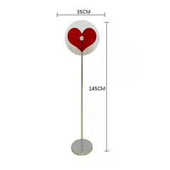Heart accent floor lamp styled in bedroom for warm glow