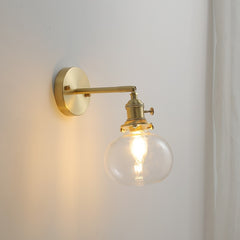  Lighted Wall-mounted wall sconce lamp illuminating a modern wall.