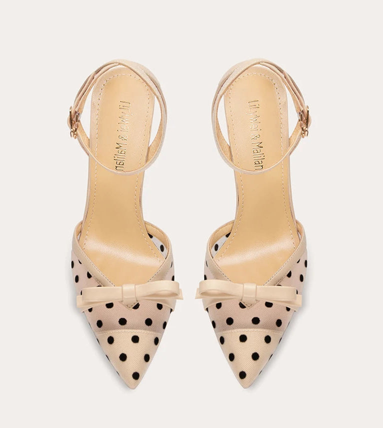 Beige polka dot bow heels for playful event styling