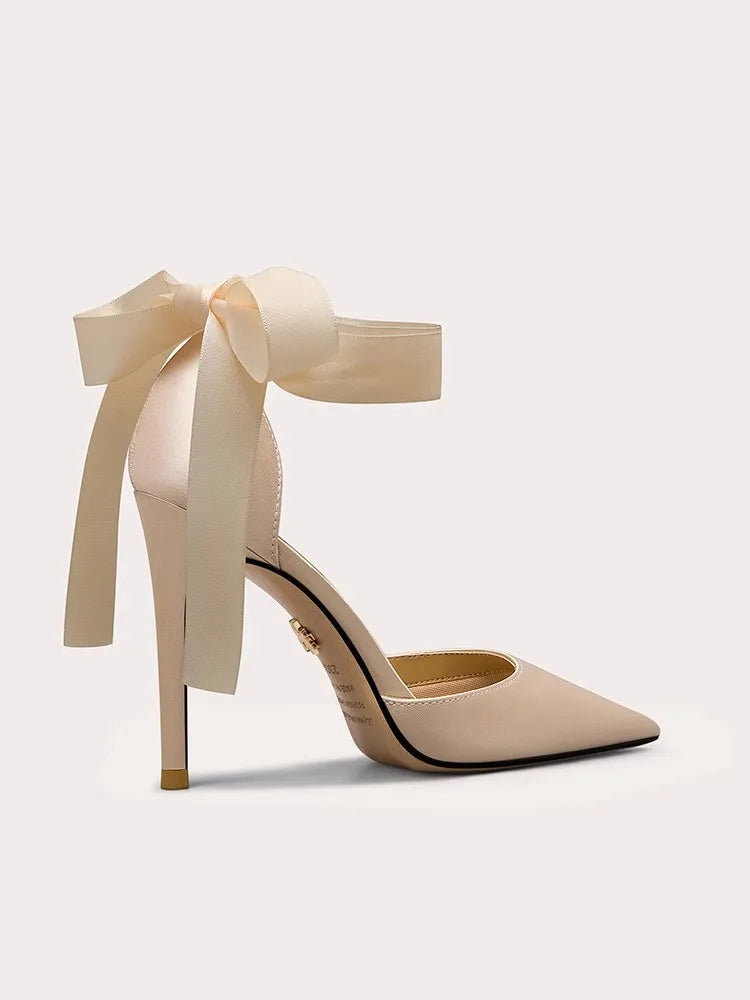 Beige silk ribbon-tie platform heels with oversized ankle bow
