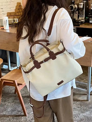 Beige vintage tote backpack with brown handles in café setting