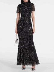 “Elegant black sheath dress with short sleeves and round neck”


