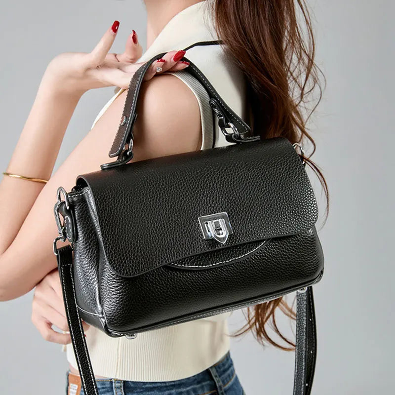 Black genuine leather crossbody bag with an envelope silhouette
