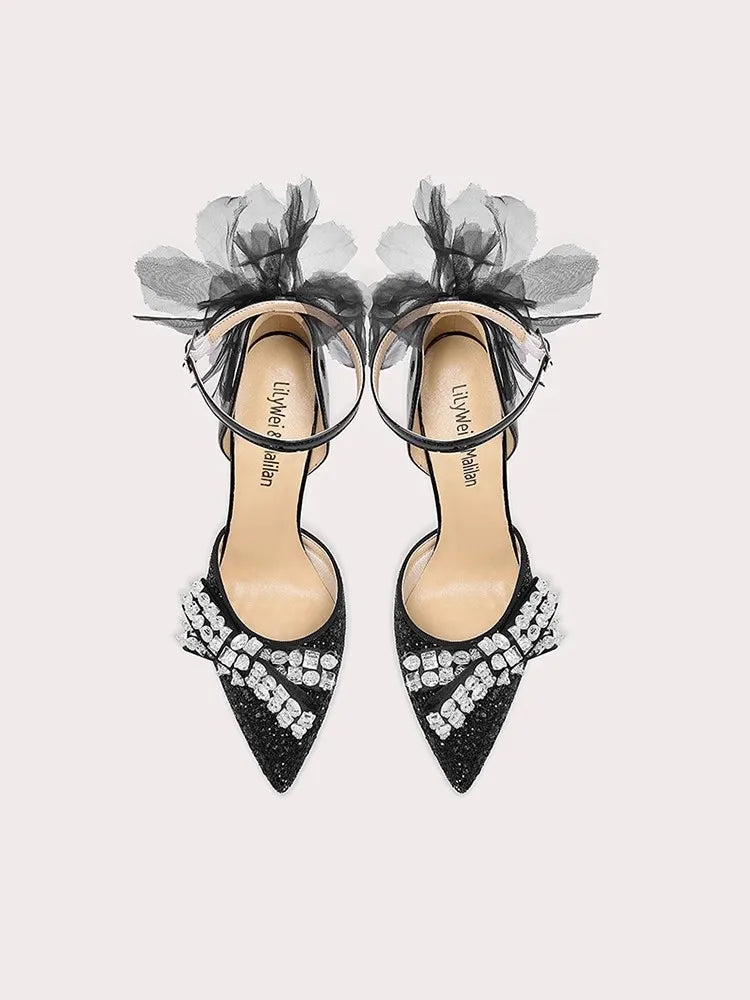 Black crystal sheer bow heels styled for party celebrations and galas