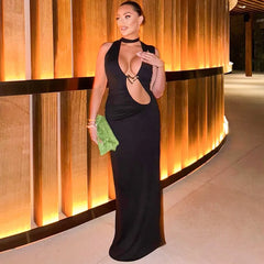 Black cut-out halter maxi dress styled for formal evenings

