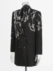 Front view of a black mini-length coat dress showing its sharp tailoring and A-line silhouette.