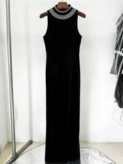 Black maxi evening dress displayed in full length, highlighting the flowing A-line shape and elegant drape.