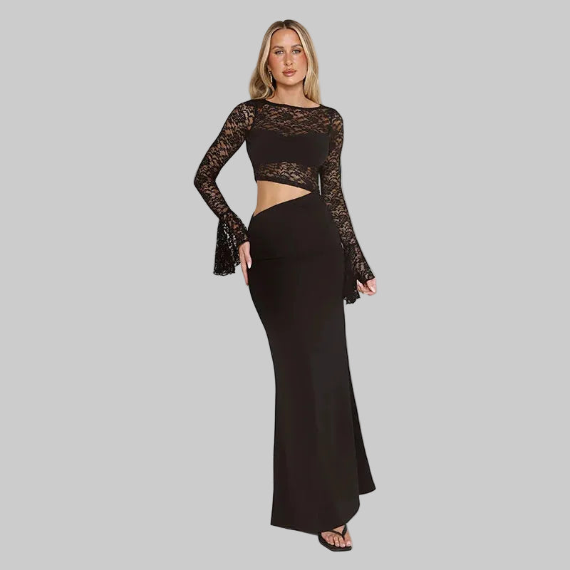 Full-length front pose highlighting the maxi hem and streamlined fit, with sheer lace sleeves adding contrast to the smooth skirt.