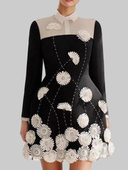 Black floral applique mini dress with white collar styled for parties