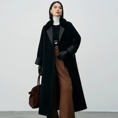 Long black coat with fur collar and leather details