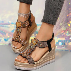 Top view of black and gold wedge sandals with 3 cm platform